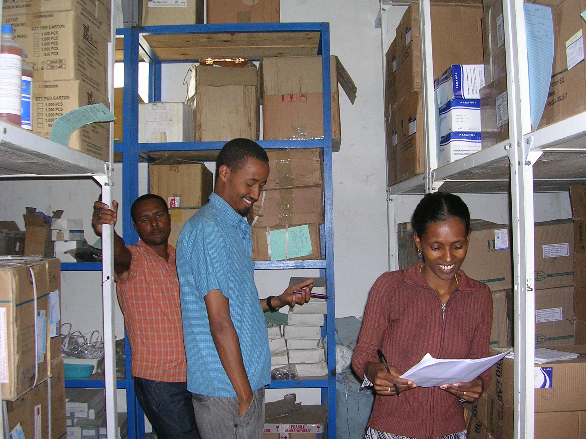 Health center staff work to improve storage practices in their storeroom
